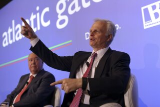 FILE - In this June 24, 2015 file photo, David Neeleman, right, talks to journalists during a joint news conference with his partner Portuguese businessman Humberto Pedrosa, in Lisbon. A new airline is one step closer to flying in the United States. The Transportation Department has given the all-clear to Breeze, which is owned by Neeleman, who founded JetBlue Airways two decades ago. According to a Transportation Department order posted Wednesday, March 10, 2021, Breeze Aviation Group has up to one year to begin flights using up to 22 planes. (AP Photo/Francisco Seco, File)