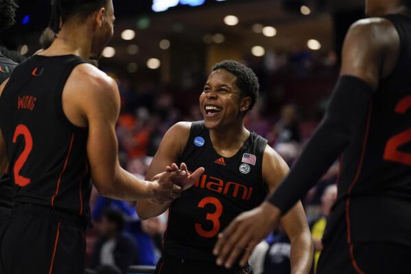 Miami's Charlie Moore (3) celebrates after a win over Auburn in a college basketball game in the second round of the NCAA tournament Sunday, March 20, 2022, in Greenville, S.C. (AP Photo/Brynn Anderson)