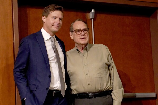 Chicago White Sox chairman Jerry Reinsdorf, right, stands with Chris Getz after he named Getz as the new senior vice president/general manager of the baseball club, during a news conference Thursday, Aug. 31, 2023, in Chicago. Getz, a former player and front office executive with the Kansas City Royals and the White Sox, is in his seventh season with the Sox baseball operations department, including the last three as assistant general manager. (AP Photo/Charles Rex Arbogast)