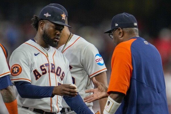 Houston Astros manager Dusty Baker takes starting pitcher Cristian Javier out of the game during the first inning of Game 6 of the baseball AL Championship Series against the Texas Rangers Monday, Oct. 23, 2023, in Houston. (AP Photo/Godofredo A. Vásquez)