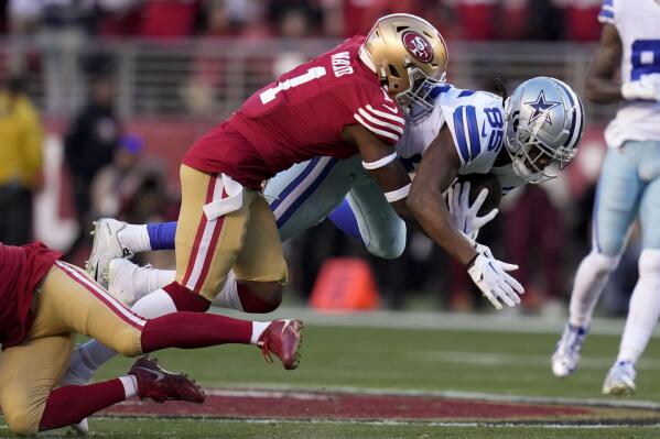 San Francisco 49ers cornerback Jimmie Ward (1) tackles Dallas Cowboys wide receiver Noah Brown during the first half of an NFL divisional round playoff football game in Santa Clara, Calif., Sunday, Jan. 22, 2023. (AP Photo/Godofredo A. Vásquez)