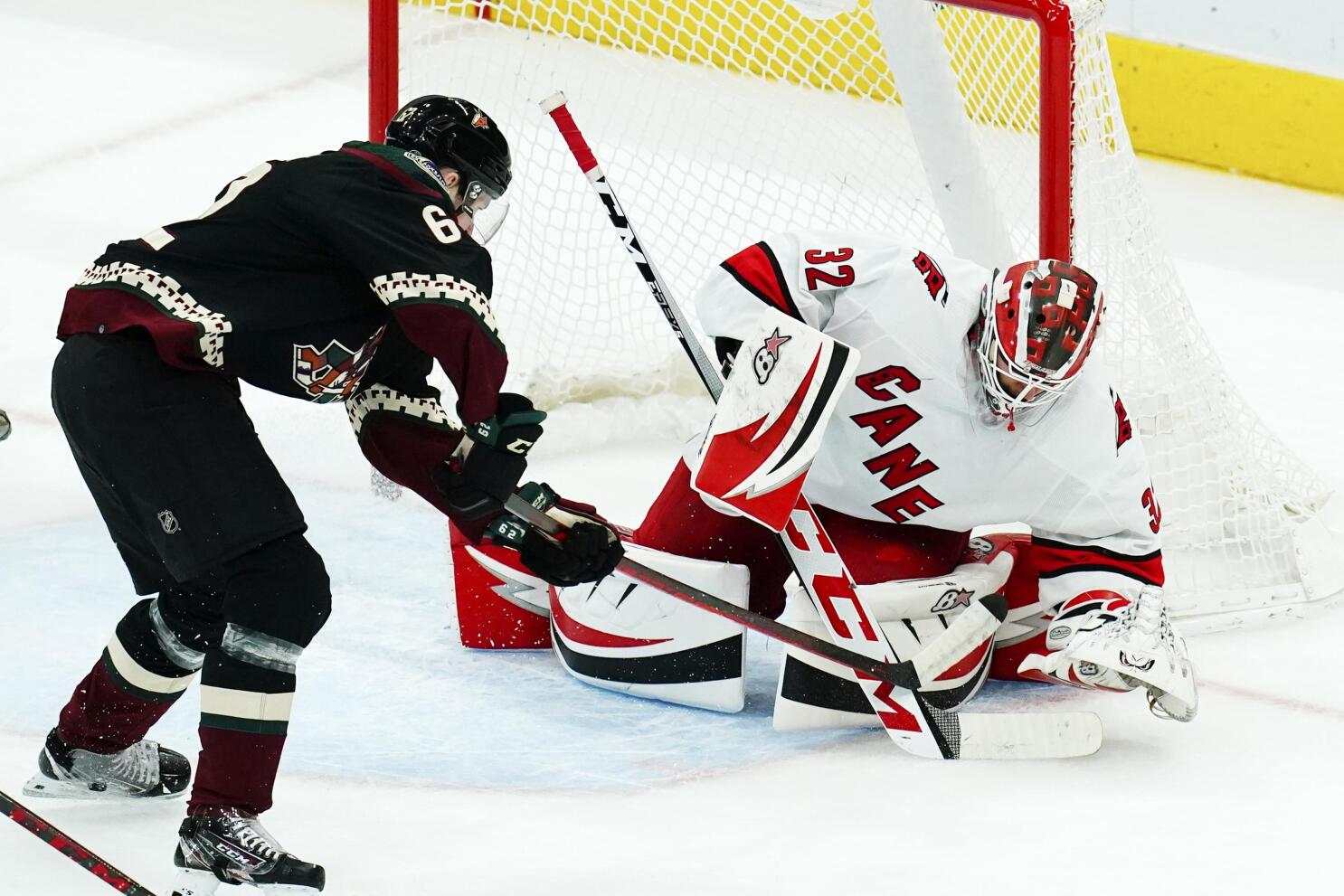 Arizona Coyotes goaltender Karel Vejmelka (70) slides over to make