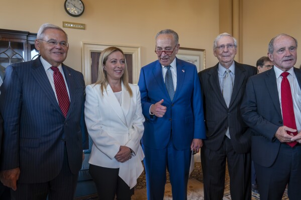 From left, Senate Foreign Relations Committee Chair Bob Menendez, D-N.J., Italian Prime Minister Giorgia Meloni, Senate Majority Leader Chuck Schumer, D-N.Y., Senate Minority Leader Mitch McConnell, and Senate Foreign Relations Committee Ranking Member Jim Risch, R-Idaho, stand for a photo before a luncheon meeting, at the Capitol in Washington, Thursday, July 27, 2023. (AP Photo/J. Scott Applewhite)