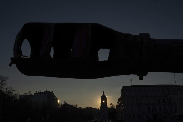 A bell tower of the Saint Sophia Cathedral is seen through the destroyed Russian artillery cannon in downtown Kyiv, Ukraine, on Monday, Jan. 29, 2024. (AP Photo/Evgeniy Maloletka)