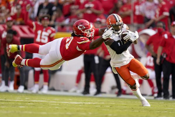 Cleveland Browns wide receiver Jarvis Landry, right, runs with the ball as Kansas City Chiefs defensive tackle Derrick Nnadi defends during the first half of an NFL football game Sunday, Sept. 12, 2021, in Kansas City, Mo. (AP Photo/Charlie Riedel)