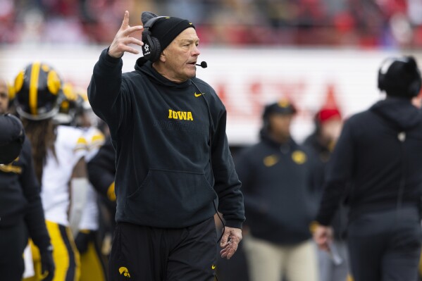 Iowa head coach Kirk Ferentz yells to his team as they play against Nebraska during the first half of an NCAA college football game, Friday, Nov. 24, 2023, in Lincoln, Neb. (AP Photo/Rebecca S. Gratz)