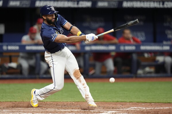 Tampa Bay Rays' Amed Rosario connects for the game-winning RBI single off Los Angeles Angels relief pitcher Carson Fulmer during the 13th inning of a baseball game Tuesday, April 16, 2024, in St. Petersburg, Fla. (AP Photo/Chris O'Meara)