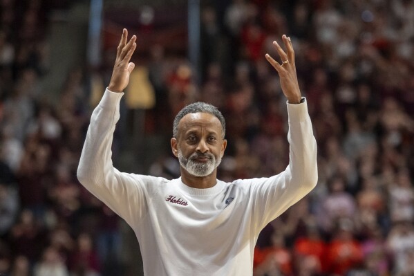 Virginia Tech head coach Kenny Brooks gets crowd involved during the second half of a second-round college basketball game in the women's NCAA Tournament against Baylor in Blacksburg, Va., Sunday, March 24, 2024. (AP Photo/Robert Simmons)