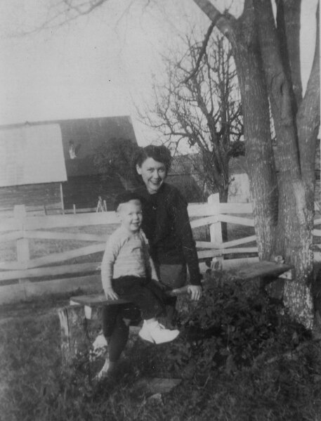 In this image provided by the McConnell Center at the University of Louisville, Mitch McConnell sits with his mother Julia "Dean" McConnell on a bench in this image from the mid 1940's in Five Points, Ala.. As the coronavirus pandemic unfolds, Senate Majority Leader Mitch McConnell flashes back to an earlier crisis that gripped the nation, and his own life, when he was a boy. He was struck with polio. (McConnell Center at the University of Louisville via AP)
