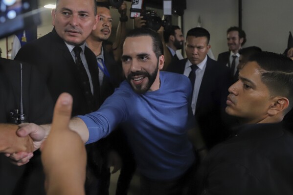 FILE - Supporters greet El Salvador's President Nayib Bukele after he presented himself as the presidential candidate for the New Ideas Party in San Salvador, El Salvador, Friday, Oct. 27, 2023. El Salvador's Nayib Bukele took his presidential reelection campaign beyond the tiny Central American country's borders Wednesday night, Jan. 3, 2024, to capitalize on his rising profile across Latin America. During a two-hour forum on the platform X, Bukele accused critics of his controversial policies of trying to keep El Salvador and other developing nations down. (AP Photo/Salvador Melendez, File)