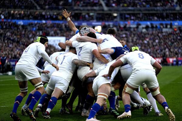 France's players perform a scrum during the Six Nations rugby union international match between France and Scotland at Stade De France in Paris, Sunday, Feb. 26, 2023. (AP Photo/ Michel Euler)