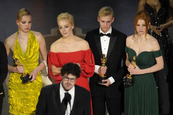 Daniel Roher and the members of the crew from "Navalny" accept the award for best documentary feature film at the Oscars on Sunday, March 12, 2023, at the Dolby Theatre in Los Angeles. (AP Photo/Chris Pizzello)