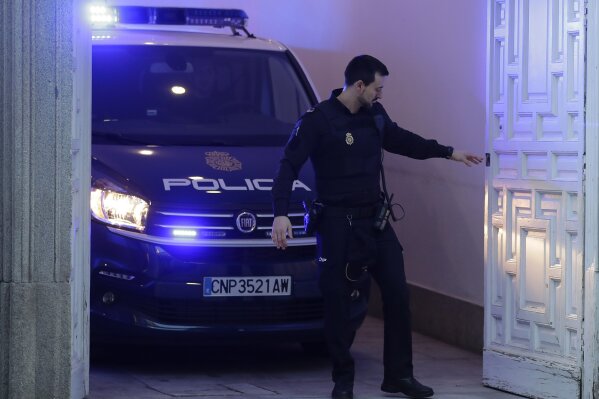 
              A Spanish National Police van, allegedly carrying Catalonian politicians and activists, arrives at the Spanish Supreme Court in Madrid, Thursday, Feb. 14, 2019. A politically charged trial of a dozen Catalan separatist leaders began Tuesday in Spain's Supreme Court amid protests and the possibility of an early general election being called in the country. (AP Photo/Manu Fernandez)
            