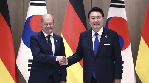 German Chancellor Olaf Scholz, left, and South Korea's President Yoon Suk Yeol shake hands before their meeting at the Presidential Office in Seoul, South Korea Sunday, May 21, 2023. Scholz arrived in Seoul on Sunday for the summit with Yoon after attending the G7 summit in Hiroshima, Japan. (Chung Sung-Jun/Pool Photo via AP)