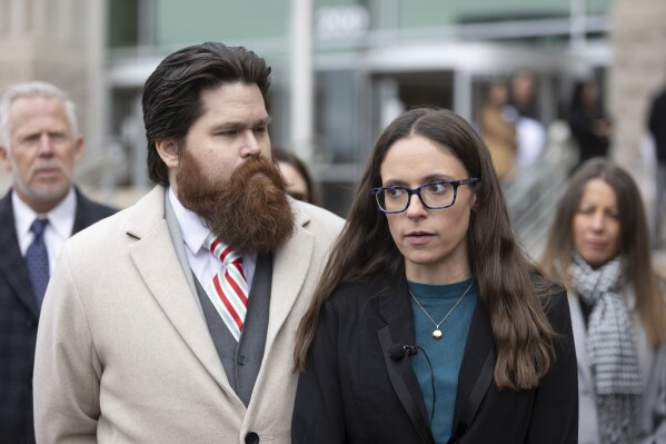 Jennifer Adkins and husband, John, from Caldwell, Idaho talk to the media outside the Ada County Courthouse, Dec. 14, 2023 in Boise, Idaho. (AP Photo/Kyle Green, File)