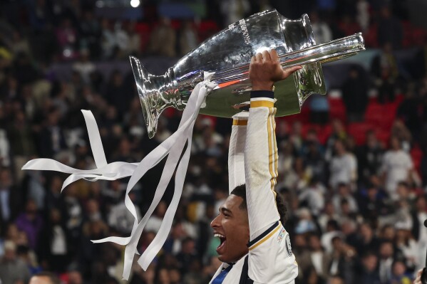 Real Madrid's Jude Bellingham celebrates at the end of the Champions League final soccer match between Borussia Dortmund and Real Madrid at Wembley stadium in London, Saturday, June 1, 2024. Real Madrid won 2-0. (AP Photo/Ian Walton)
