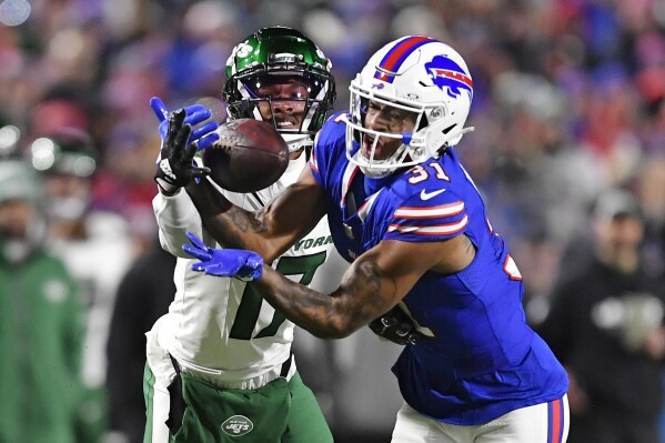Buffalo Bills cornerback Rasul Douglas (31) intercepts a pass intended for New York Jets wide receiver Garrett Wilson (17) during the first half of an NFL football game in Orchard Park, N.Y., Sunday, Nov. 19, 2023. (AP Photo/Adrian Kraus)