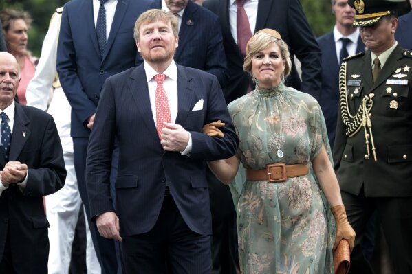 King Willem-Alexander of the Netherlands, left, walks with his wife Queen Maxima during their visit at a Dutch war cemetery in Jakarta, Indonesia, Tuesday, March 10, 2020. The Dutch royal couple are currently on on a five-day visit in the country. (AP Photo/Dita Alangkara)