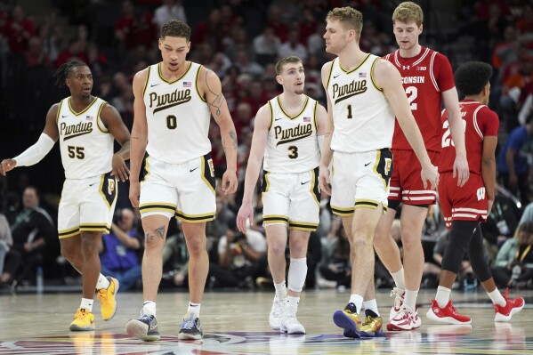 Purdue guard Braden Smith (3) talks with teammates after missing a shot during the second half of an NCAA college basketball game against Wisconsin in the semifinal round of the Big Ten Conference tournament, Saturday, March 16, 2024, in Minneapolis. (AP Photo/Abbie Parr)
