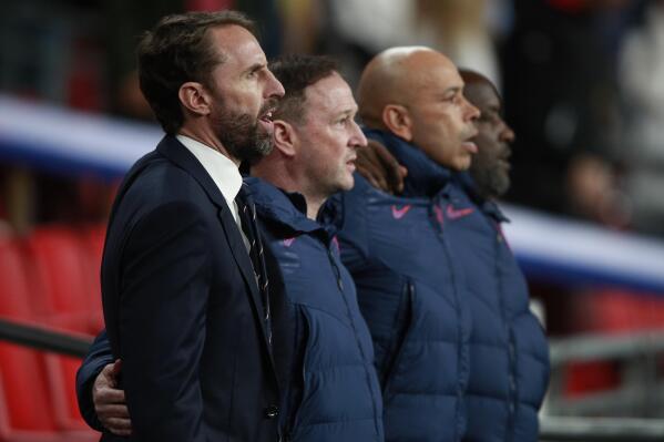 England's manager Gareth Southgate sings the national anthem ahead of the World Cup 2022 group I qualifying soccer match between England and Albania at Wembley stadium in London, Friday, Nov. 12, 2021. (AP Photo/Ian Walton)