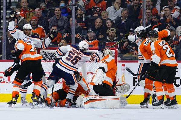 Edmonton Oilers' Kailer Yamamoto (56) celebrates after scoring a goal against Philadelphia Flyers' Carter Hart (79) during the second period of an NHL hockey game, Tuesday, March 1, 2022, in Philadelphia. (AP Photo/Matt Slocum)
