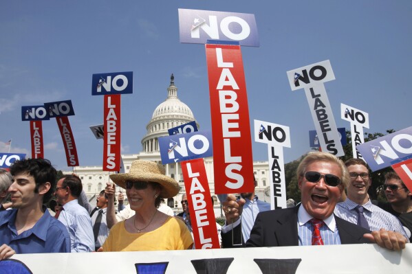 FILE - John Holman, of Denver, Colo., right, and others with the group "No Labels" take part in a rally on Capitol Hill in Washington, July 18, 2011. North Carolina voters could have another presidential ticket to choose from in 2024 now that state election officials have formally granted the “No Labels” movement a spot on the ballot. The State Board of Elections voted 4-1 on Sunday, Aug. 13, 2023, to recognize the No Labels Party as an official North Carolina party following a successful petition effort. (AP Photo/Jacquelyn Martin, File)