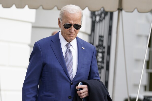 President Joe Biden walks to speak to the media before boarding Marine One on the South Lawn of the White House, Thursday, Jan. 18, 2024, in Washington. Biden is traveling to North Carolina to highlight $82 million in new investments that would connect 16,000 households and businesses to high-speed internet. (AP Photo/Yuri Gripas)