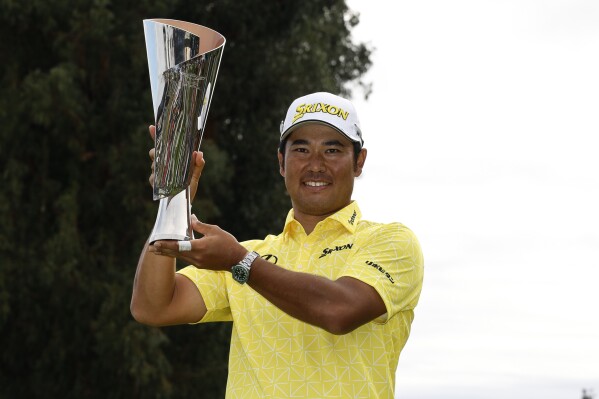 Hideki Matsuyama, of Japan, holds the the Genesis Invitational trophy after he won the final round of the Genesis Invitational golf tournament at Riviera Country Club, Sunday, Feb. 18, 2024, in the Pacific Palisades area of, Los Angeles. (APPhoto/Ryan Kang)