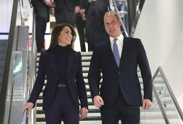 Britain's Prince William and Kate, Princess of Wales, arrive at Boston Logan International Airport, Wednesday, Nov. 30, 2022, in Boston. The Prince and Princess of Wales are making their first overseas trip since the death of Queen Elizabeth II in September. (John Tlumacki/The Boston Globe via AP, Pool)