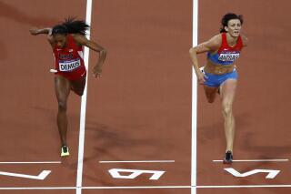 FILE - Russia's Natalya Antyukh, right, powers ahead of United States' Lashinda Demus to win gold in the women's 400-meter hurdles final during the athletics in the Olympic Stadium at the 2012 Summer Olympics, London, Wednesday, Aug. 8, 2012. Russian runner Natalya Antyukh was disqualified on Monday, Oct. 24, 2022 from her 400-meter hurdles win at the 2012 London Olympics for doping, and Lashinda Demus of the United States is set to be upgraded to the gold medal. (AP Photo/Daniel Ochoa De Olza, File)