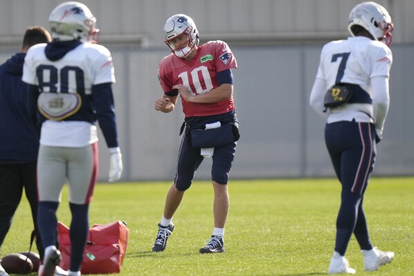 New England Patriots quarterback Mac Jones (10) warms up during an NFL football practice, Wednesday, Nov. 15, 2023, in Foxborough, Mass. (AP Photo/Steven Senne)