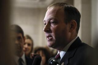 FILE - In this Friday Nov. 15, 2019, file photo Rep. Lee Zeldin, R-N.Y., speaks to reporters on Capitol Hill in Washington. Zeldin said Saturday, Sept. 18, 2021, that he was diagnosed last November with early stage chronic myeloid leukemia but that he responded well to treatments and is now in remission. (AP Photo/Jacquelyn Martin, File)