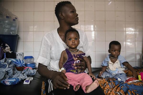 FILE- Malnourished children wait for treatment in the pediatrics department of Boulmiougou hospital in Ouagadougou, Burkina Faso, on April 15, 2022. Hunger is soaring and spreading across West Africa, with some 48 million people, a 10-year-high, facing food insecurity in the conflict-riddled region, the United Nations warned Tuesday April 18, 2023. (AP Photo/Sophie Garcia, File)