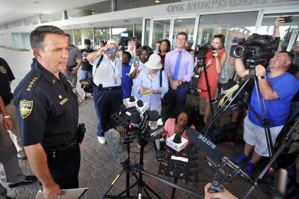 
              Jacksonville Sheriff Mike Williams addresses the media across the street from the scene of a multiple shooting at The Jacksonville Landing during a video game tournament, Sunday, Aug. 26, 2018, in Jacksonville, Fla. (Will Dickey/The Florida Times-Union via AP)
            
