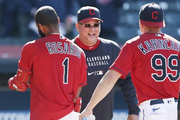 FILE - In this Wednesday, May 12, 2021 file photo, Cleveland Indians manager Terry Francona, center, celebrates with Amed Rosario (1) and James Karinchak (99) after defeating the Chicago Cubs 2-1 in 10 innings of a baseball game in Cleveland. Indians manager Terry Francona is confident he'll return next season after missing most of the past two because of serious health issues. Francona was forced to step away from the club in late July to undergo surgeries on his hip and big toe(AP Photo/Ron Schwane, File)
