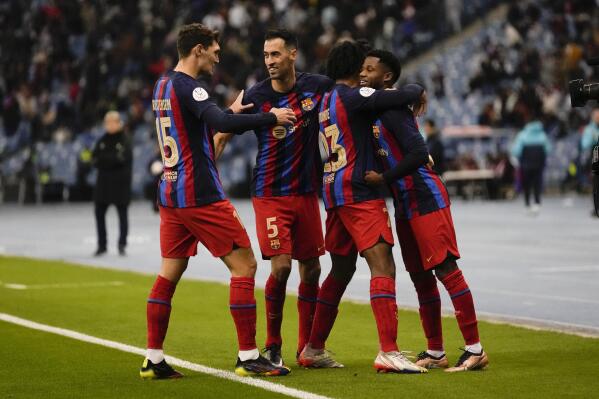 Barcelona's players celebrate after a goal during a semi-final of the Spanish Super Cup between Barcelona and Real Betis in Riyadh, Saudi Arabia, Thursday, Jan. 12, 2023. (AP Photo/Hussein Malla)
