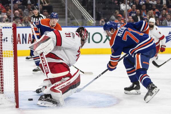 Carolina Hurricanes' Frederik Andersen (31) is scored against by Edmonton Oilers' Ryan McLeod (71) during second-period NHL hockey game action in Edmonton, Alberta, Thursday, Oct. 20, 2022. (Jason Franson/The Canadian Press via AP)