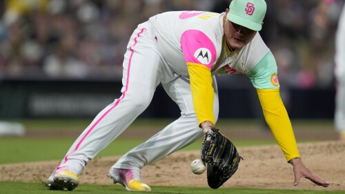 San Diego Padres relief pitcher Adrian Morejon fields a ground ball before throwing to first for the out on New York Mets' Luis Guillorme during the sixth inning of a baseball game Friday, July 7, 2023, in San Diego. (AP Photo/Gregory Bull)