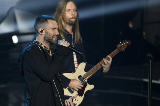 
              FILE - In this Sunday, March 11, 2018 file photo, Adam Levine, left, and James Valentine of Maroon 5 perform during the 2018 iHeartRadio Music Awards at The Forum in Inglewood, Calif. Maroon 5 has canceled its news conference to discuss the band's Super Bowl halftime performance, choosing to not meet with reporters as most acts have done during the week leading up to the NFL's big game. The NFL announced Tuesday, Jan. 29, 2019 that “the artists will let their show do the talking as they prepare to take the stage this Sunday.” (Photo by Chris Pizzello/Invision/AP, File)
            