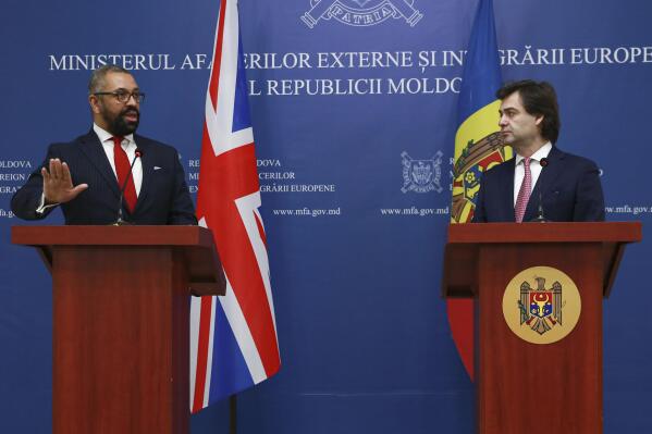 British Foreign Secretary James Cleverly, left, gestures during joint press statements with Moldova's Foreign Minister Nicu Popescu in Chisinau, Moldova, Thursday, March 16, 2023.(AP Photo/Aurel Obreja)