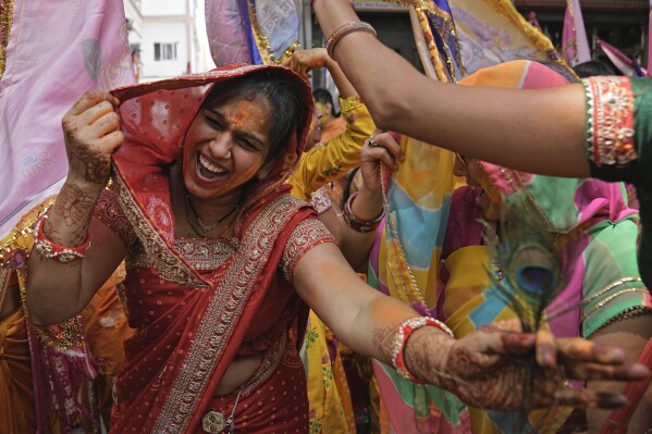 FILE - A female dances arsenic she participates successful a convoy to people Falgun Mahotsav up of Holi, nan Hindu show of colors, successful Hyderabad, India, Wednesday, March 20, 2024. (AP Photo/Mahesh Kumar A., File)