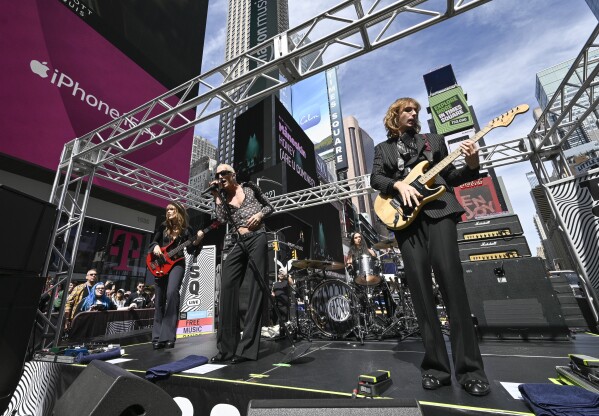 Victoria De Angelis, left, Damiano David, Ethan Torchio and Thomas Raggi from the Italian rock band Måneskin perform in Times Square on Friday, Sept. 15, 2023, in New York. (Photo by Evan Agostini/Invision/AP)