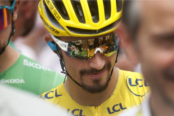 France's Julian Alaphilippe wearing the overall leader's yellow jersey arrives at the start of the fifteenth stage of the Tour de France cycling race over 185 kilometers (114,95 miles) with start in Limoux and finish in Prat d'Albis, France, Sunday, July 21, 2019. (AP Photo/Thibault Camus)