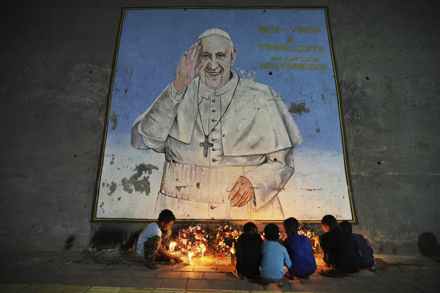 Photos show Pope Francis' image is everywhere as the Catholic faithful mourn him with art and thanks