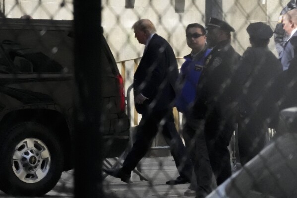 Former President Donald Trump, center, leaves Manhattan criminal court, Monday, April 22, 2024, in New York. (AP Photo/Mary Altaffer)