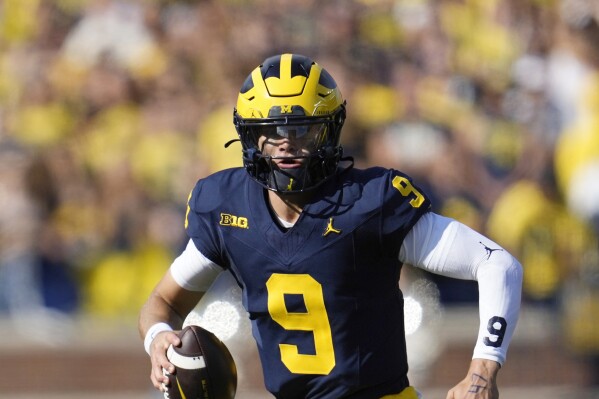 Michigan quarterback J.J. McCarthy (9) looks to throw against UNLV in the first half of an NCAA college football game in Ann Arbor, Mich., Saturday, Sept. 9, 2023. (AP Photo/Paul Sancya)