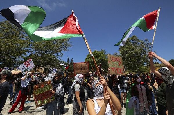 FILE - University of California, Santa Cruz graduate students and other academic workers begin a strike and are joined by UCSC students for Justice in Palestine, on Monday, May 20, 2024, in Santa Cruz, Calif. A state judge has ordered academic workers at the University of California to temporarily halt their weekslong strike over the war in Gaza. (Shmuel Thaler/The Santa Cruz Sentinel via AP, file)