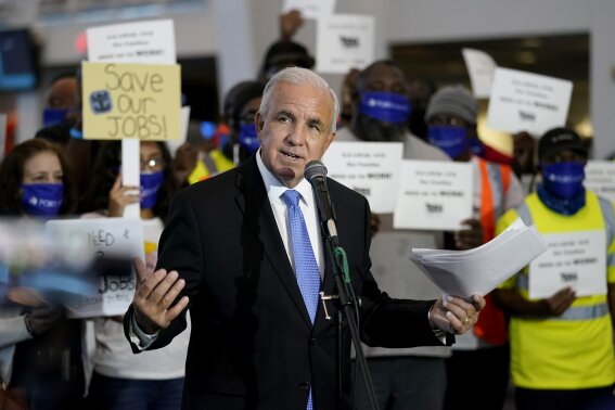 Miami-Dade County Mayor Carlos Gimenez speaks during a protest at PortMiami by workers in the cruise ship industry wanting to return to work, Wednesday, Oct. 21, 2020, in Miami. The Centers for Disease Control and Prevention (CDC) issued a No Sail Order for cruise ships through Oct. 31 during the coronavirus pandemic. (AP Photo/Lynne Sladky)