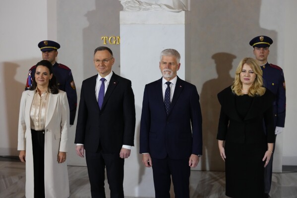 Czech Republic's President Petr Pavel, 2nd right, Slovakia's President Zuzana Caputova, right, Poland's President Andrzej Duda, 2nd left, and Hungarian President Katalin Novak pose for a photo as they meet during the V4 Summit in Prague, Czech Republic, Wednesday, Nov. 22, 2023. (AP Photo/Petr David Josek)