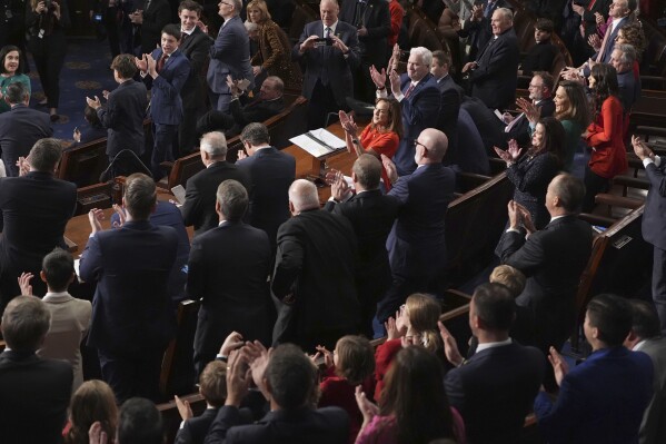 Republicans applaud after House Speaker Mike Johnson, R-La., bowing center left, votes for himself as the House of Representatives meets to elect a speaker and convene the new 119th Congress at the Capitol in Washington, Friday, Jan. 3, 2025. (AP Photo/Jacquelyn Martin)